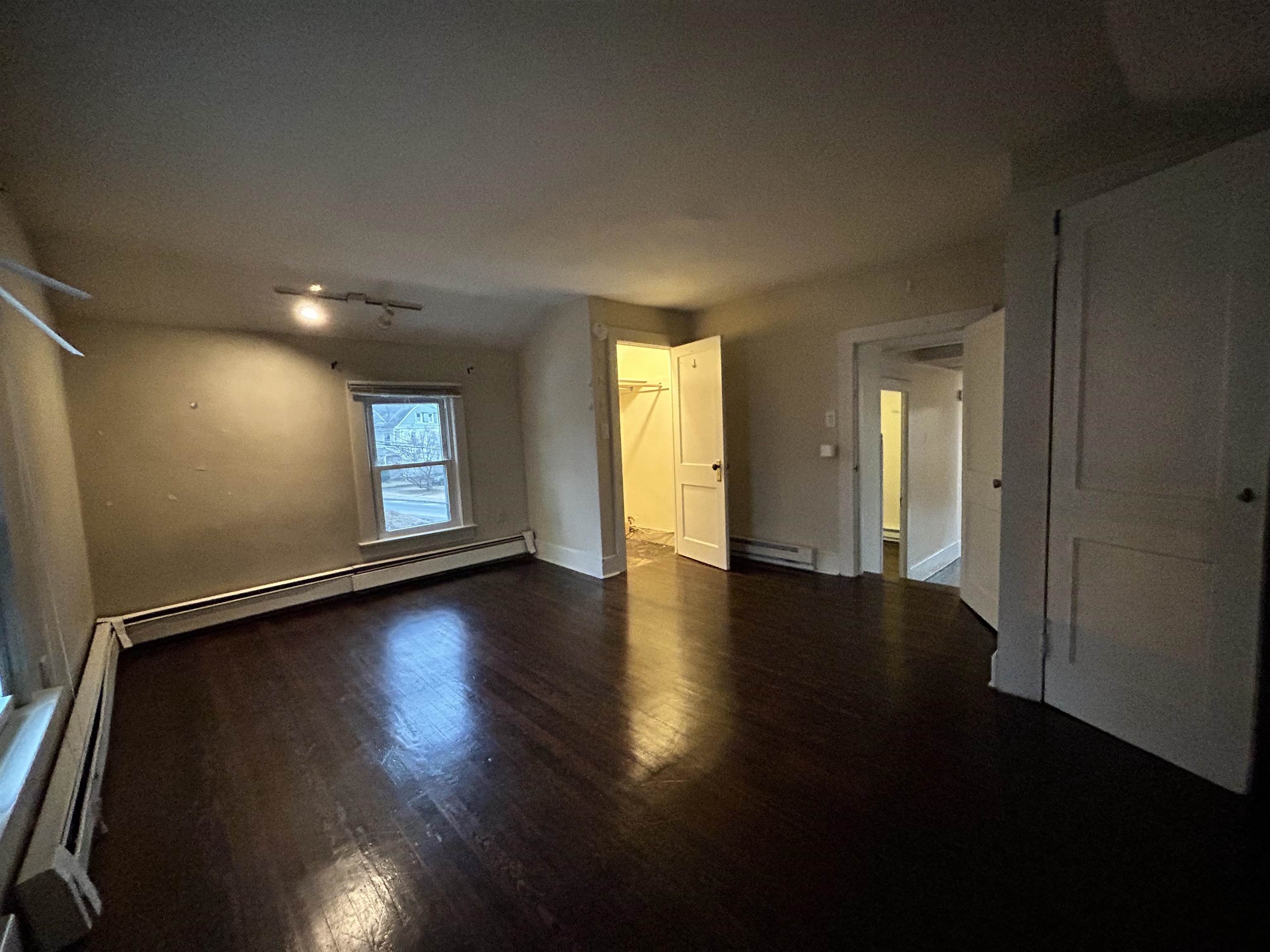 86 South Morris Street, Unit B Dover, NJ 07801 - Photo 7 of 11 a view of a livingroom with wooden floor and window