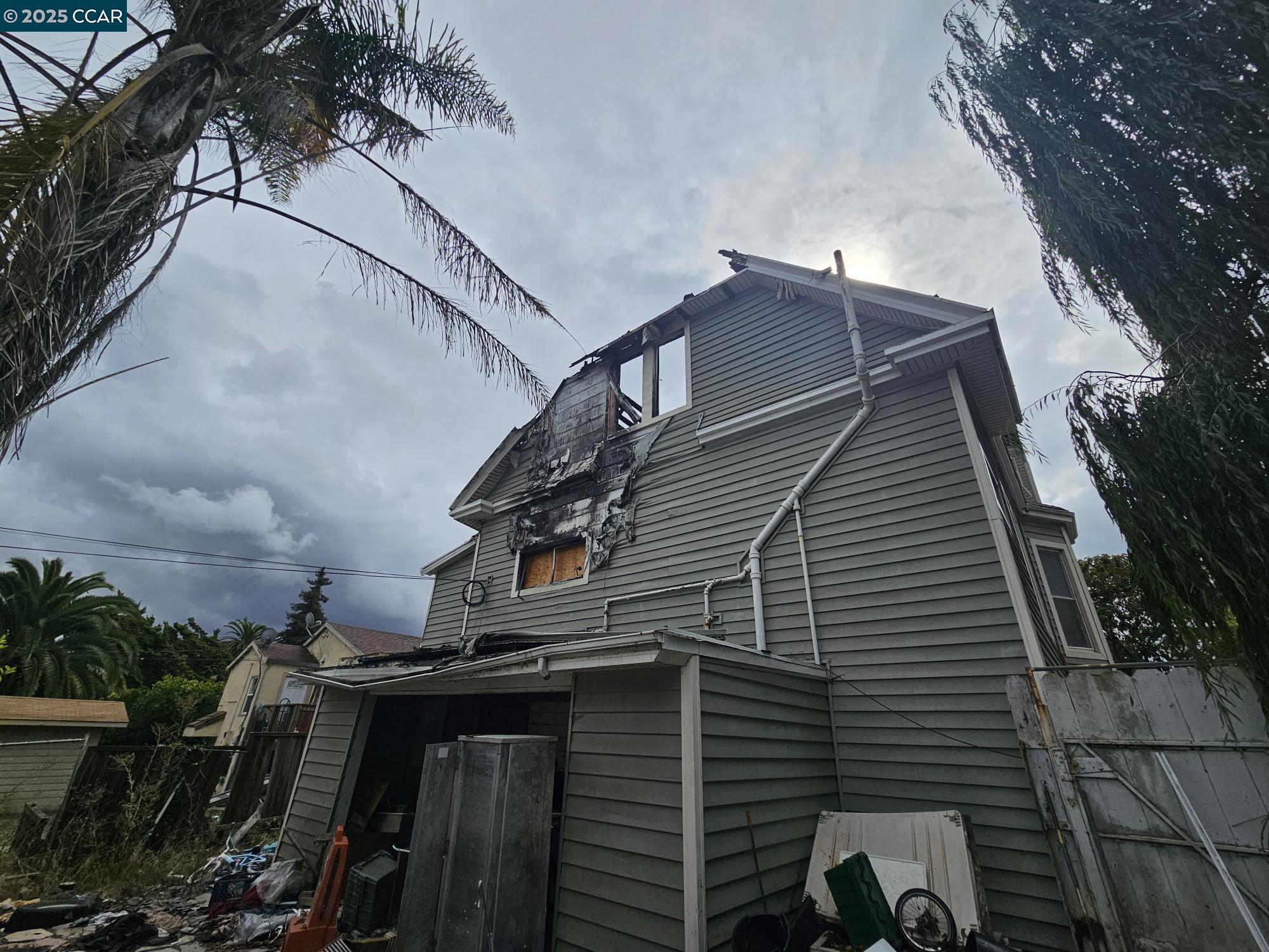 802 Ohio Street Vallejo, CA 94590 - Photo 8 of 14 a view of balcony with wooden floor and fence and a potted plant