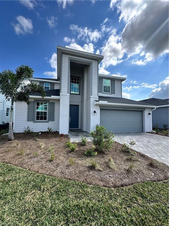 14956 White Pearl Road Babcock Ranch, FL 33982 - Photo 1 of 2 a front view of a house with garden