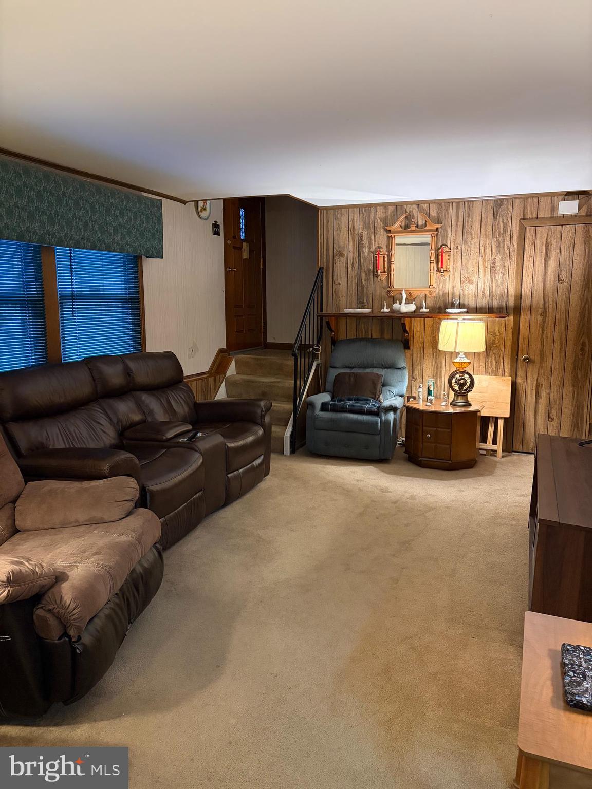 1336 Passage Drive Odenton, MD 21113 - Photo 8 of 14 a living room with furniture a flat screen tv and a large window