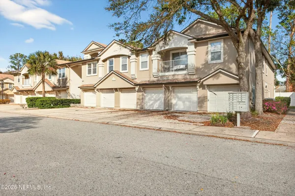 front view of a house next to a yard