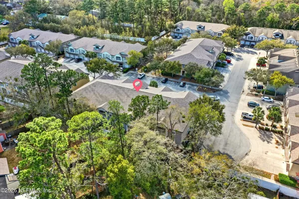an aerial view of residential houses with outdoor space