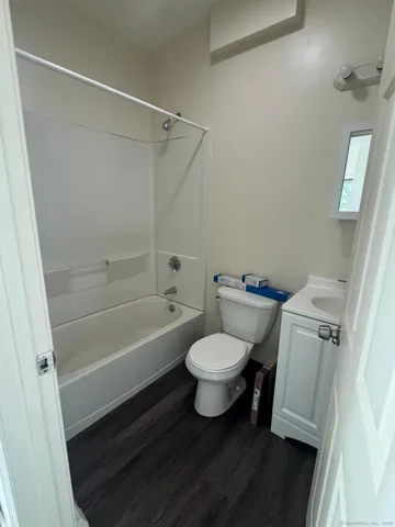 a bathroom with a toilet a sink and a bathtub