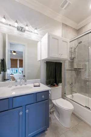 a kitchen with a sink a stove and cabinets