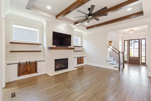 a bathroom with a granite countertop sink shower and a mirror