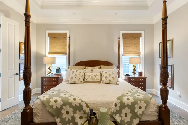 a bedroom with a bed and a lamp