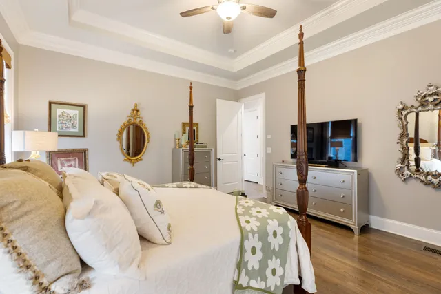 a bathroom with a granite countertop sink mirror vanity shower and toilet