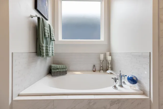 a living room with furniture a rug and a window