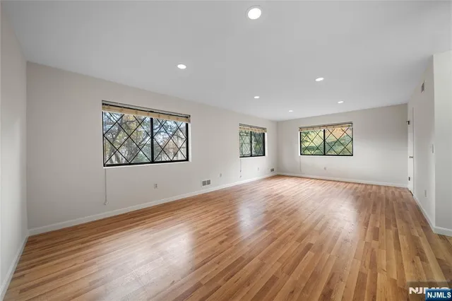 a view of an empty room and a window