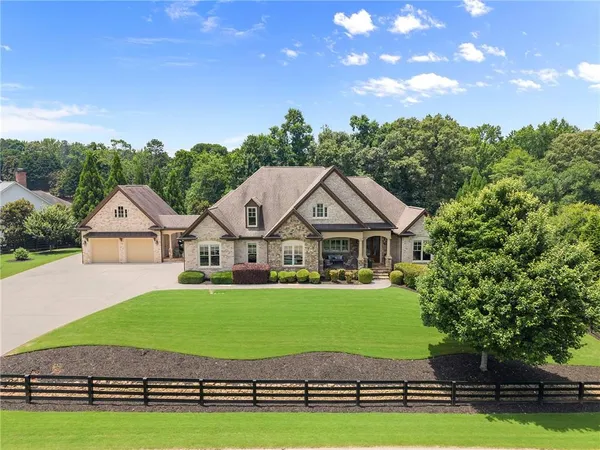 a front view of a house with a yard