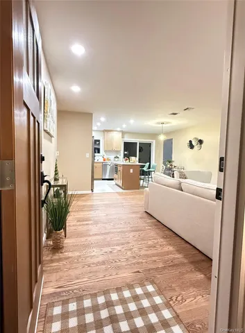 a large white kitchen with a large window