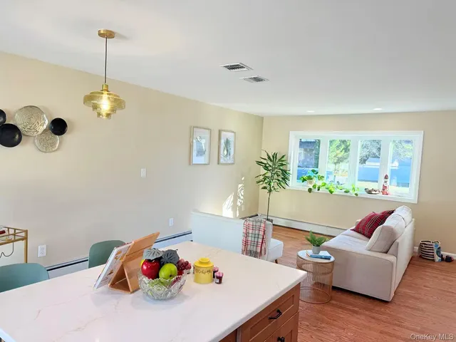a living room with furniture and a table