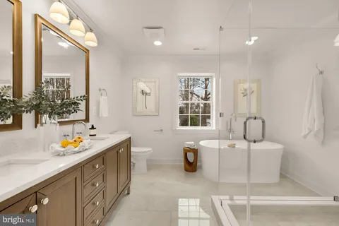 a bathroom with a bathtub and a window