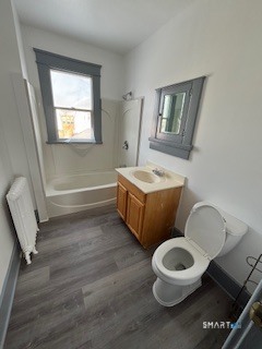 14 Guilfoile Street, Unit 2 Waterbury, CT 06708 - Photo 10 of 17 a bathroom with a toilet sink and mirror