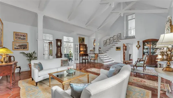 a living room with furniture and a table