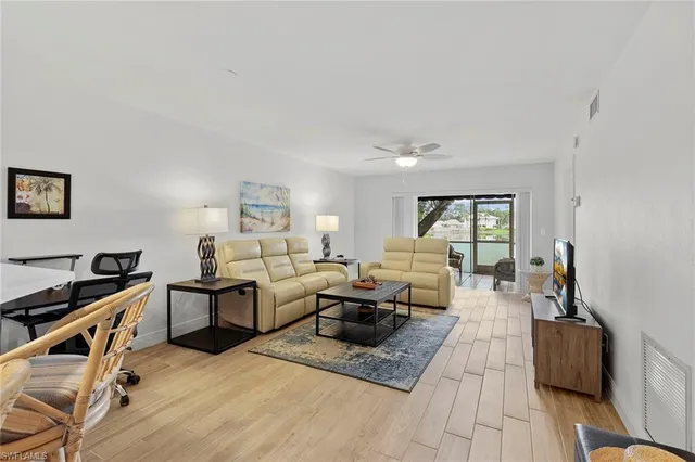a living room with furniture window and a table