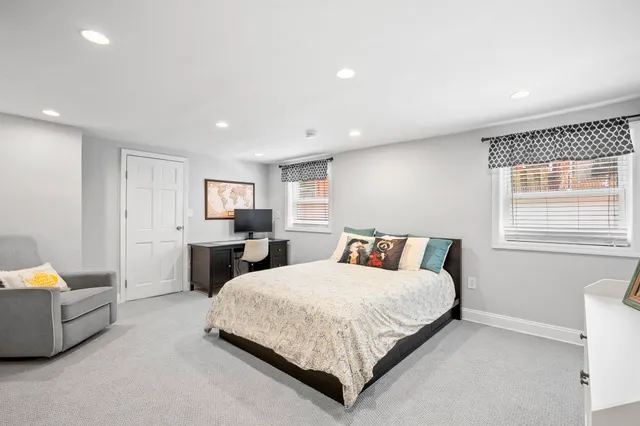 a bedroom with a bed and a couch