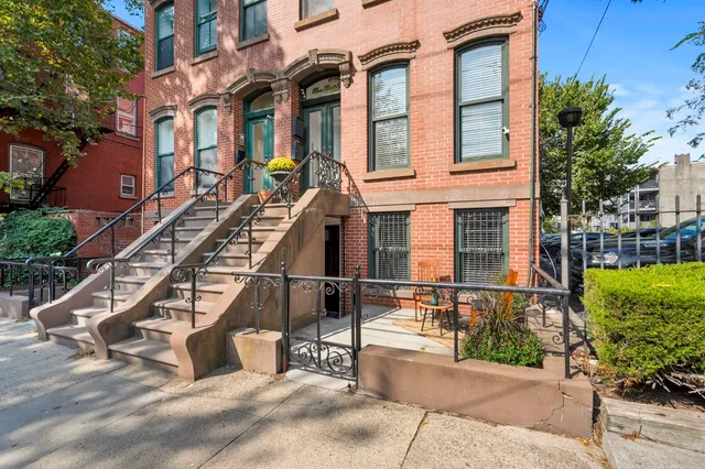 a front view of a building with garden