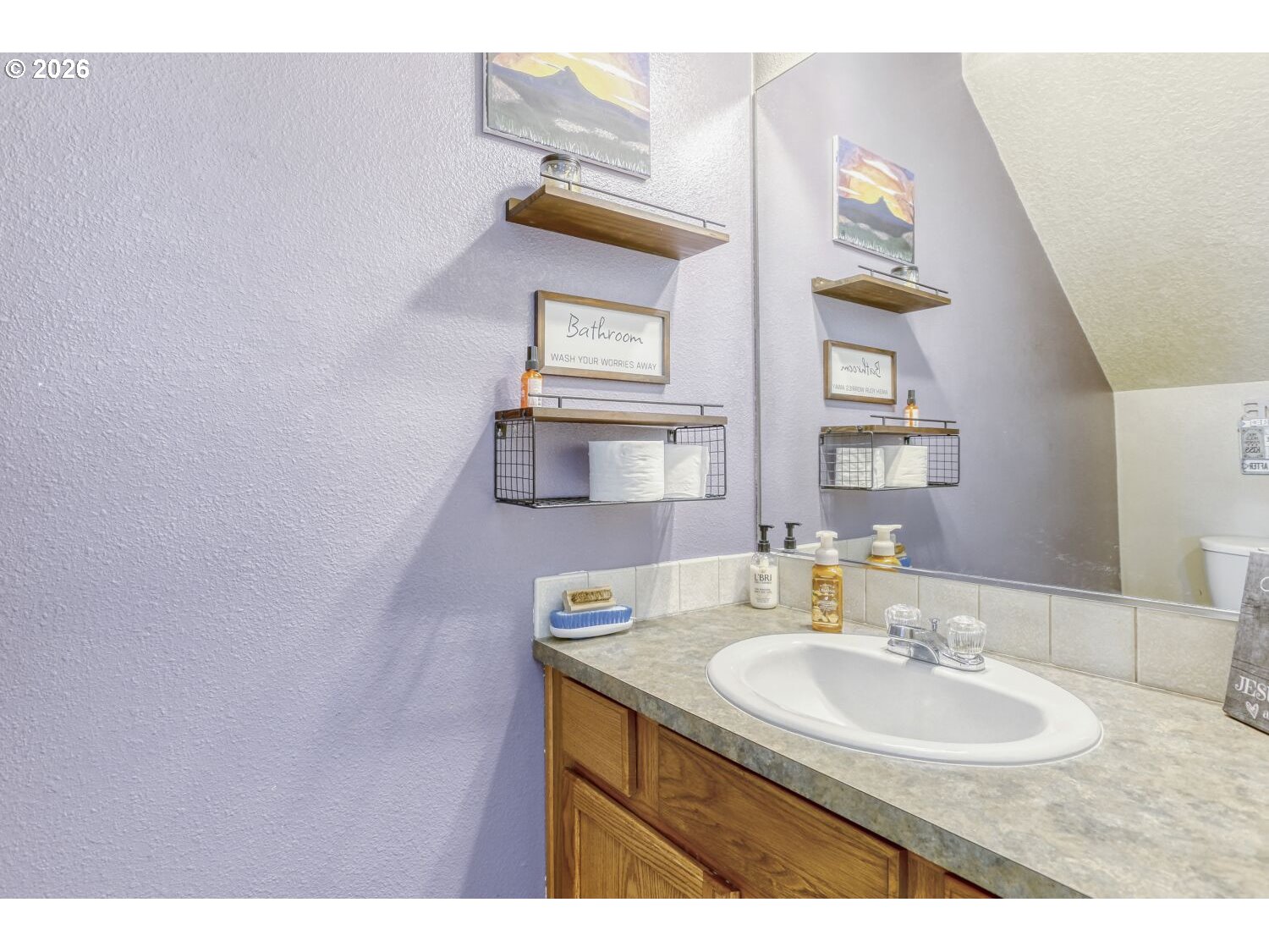 147 Southwest Wright Avenue Troutdale, OR 97060 - Photo 12 of 27 a bathroom with a sink and a mirror