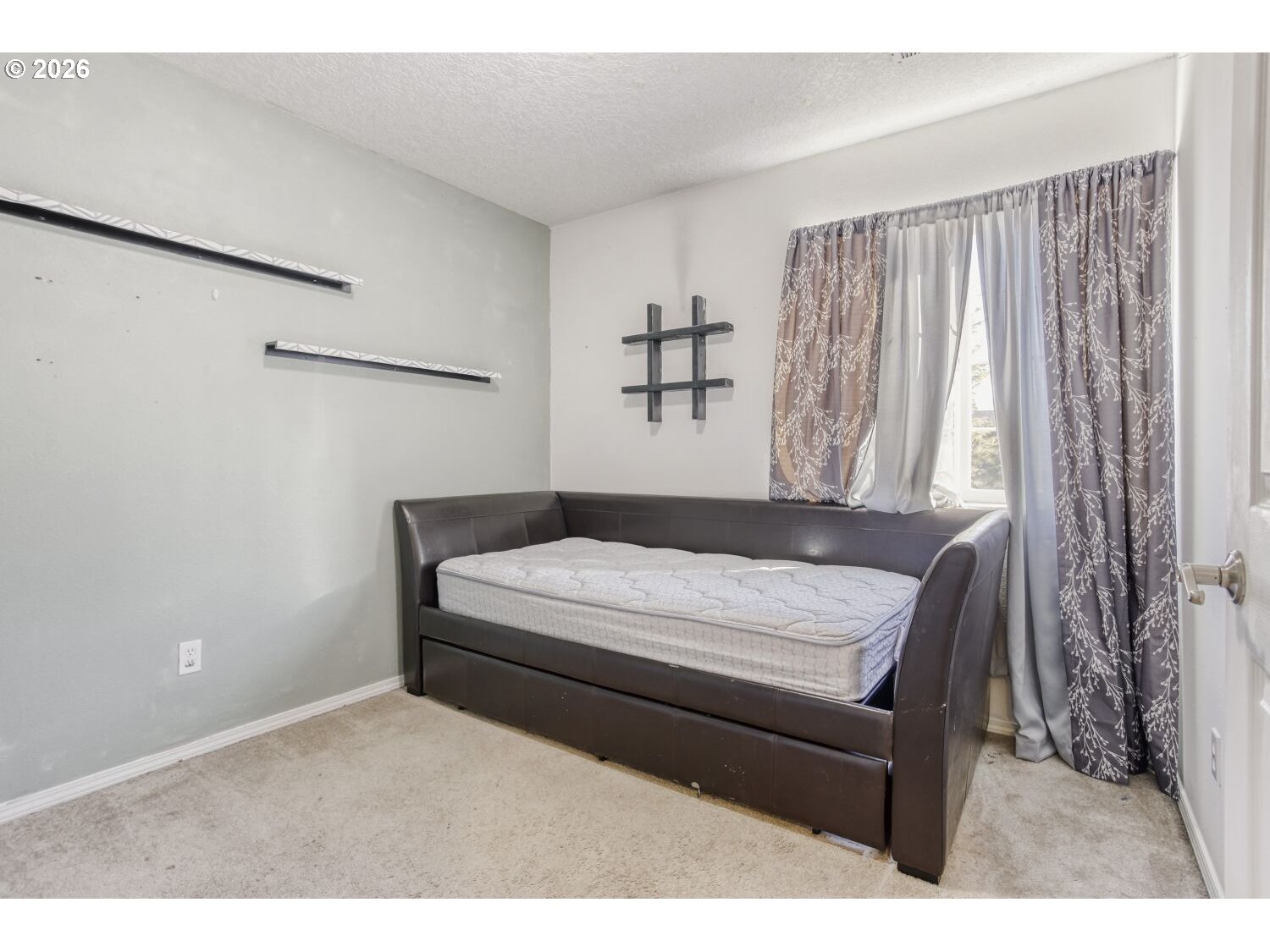 147 Southwest Wright Avenue Troutdale, OR 97060 - Photo 22 of 27 a bedroom with a bed and a window