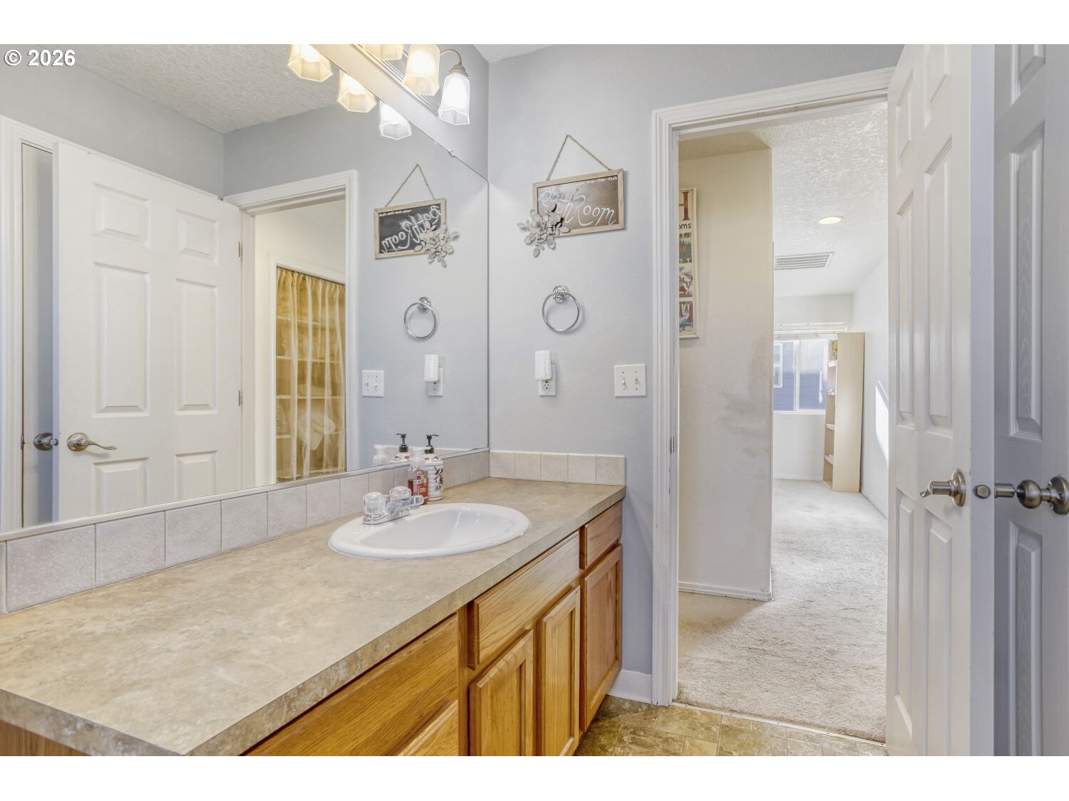 147 Southwest Wright Avenue Troutdale, OR 97060 - Photo 25 of 27 a bathroom with a sink and a mirror