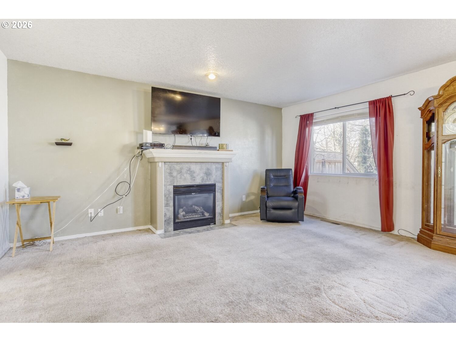 147 Southwest Wright Avenue Troutdale, OR 97060 - Photo 6 of 27 a living room with furniture a fireplace and a flat screen tv