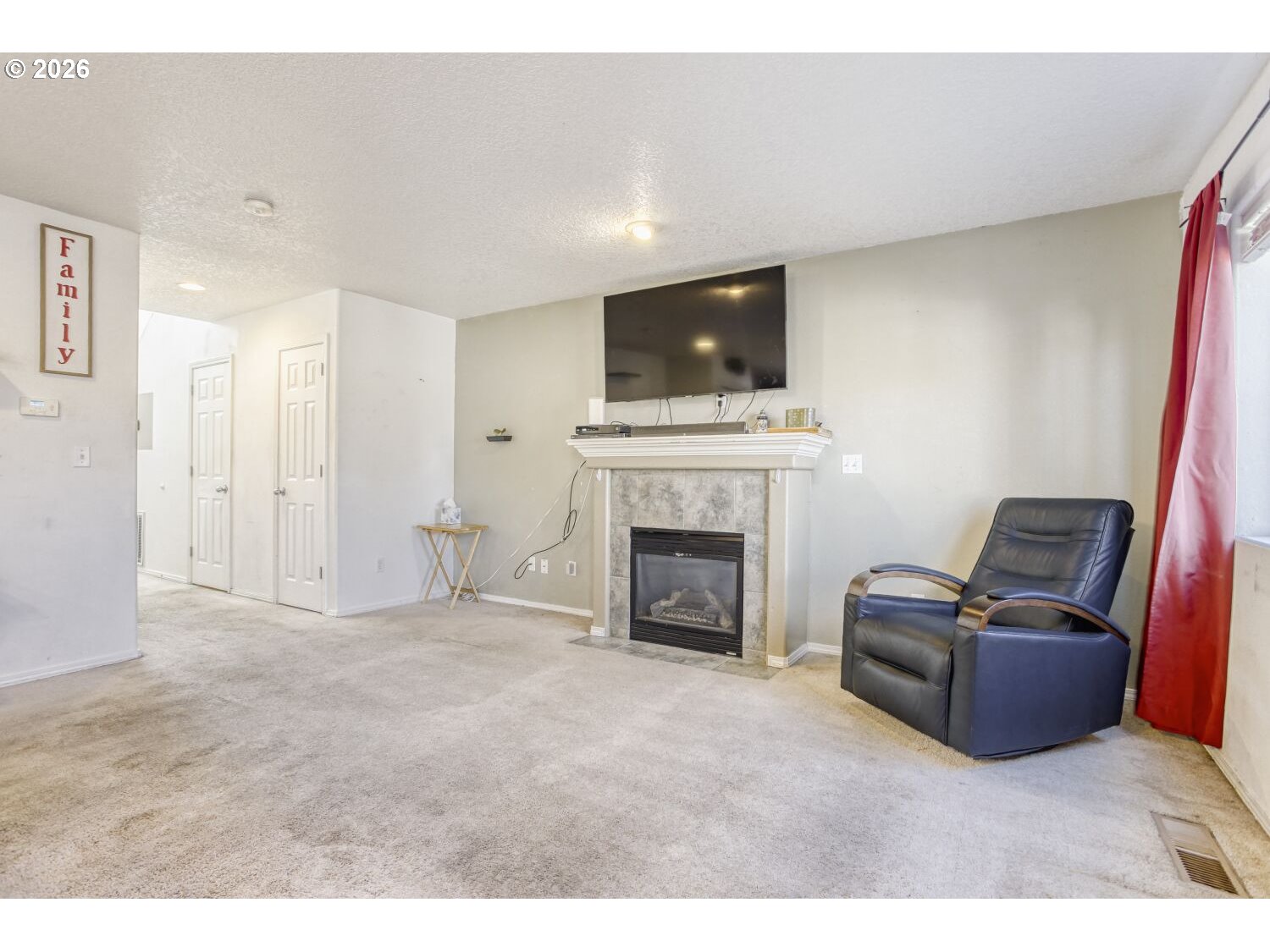 147 Southwest Wright Avenue Troutdale, OR 97060 - Photo 7 of 27 a living room with furniture a flat screen tv and a fireplace