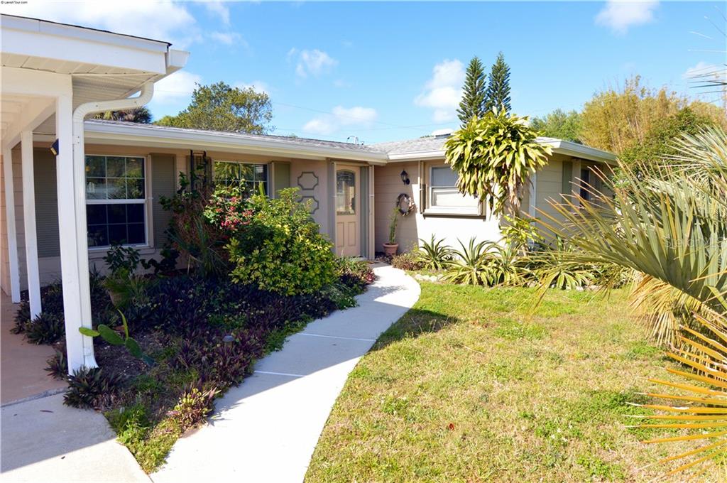354 Sea Grape Road Venice, FL 34293 - Photo 1 of 1 Walkway to front entry