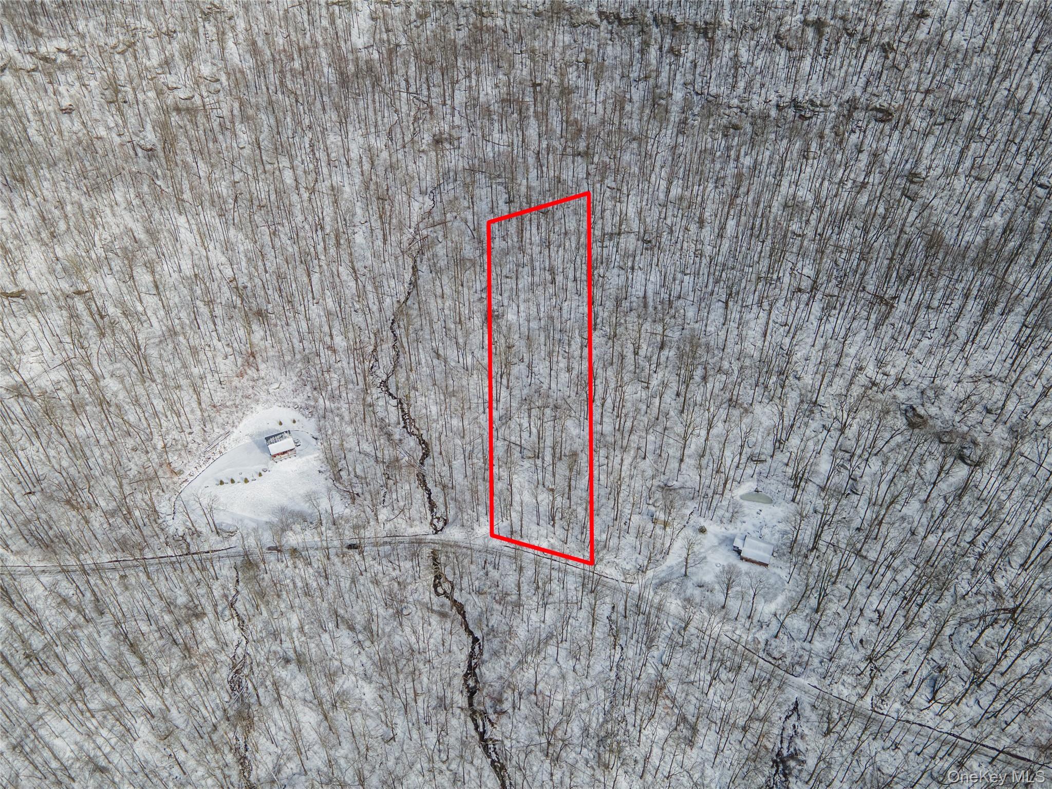 499 Cross Mountain Road Livingston Manor, NY 12758 - Photo 2 of 4 a signage on a brick wall