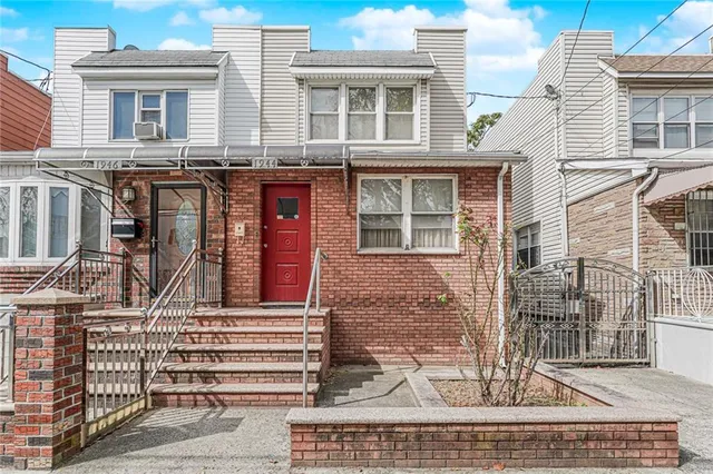 a front view of a house with glass windows
