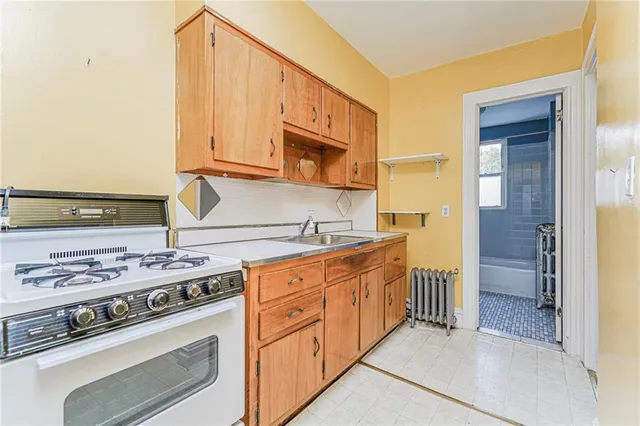 a kitchen with a refrigerator and a sink