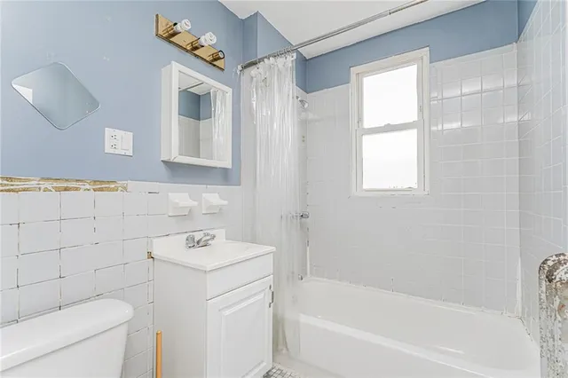 a front view of a building with a yard