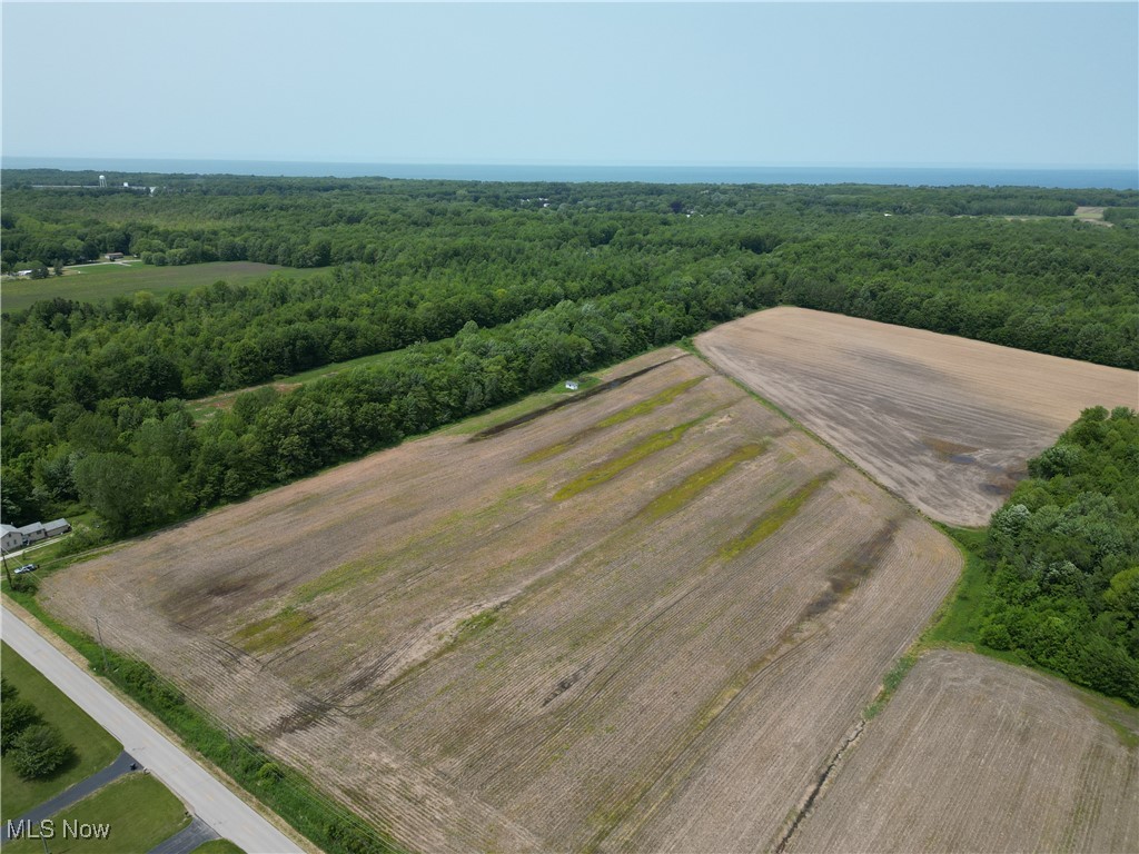 0 Creek Road Conneaut, OH 44030 - Photo 4 of 5 Overview of rural landscape with a heavily wooded area and abundant farmland