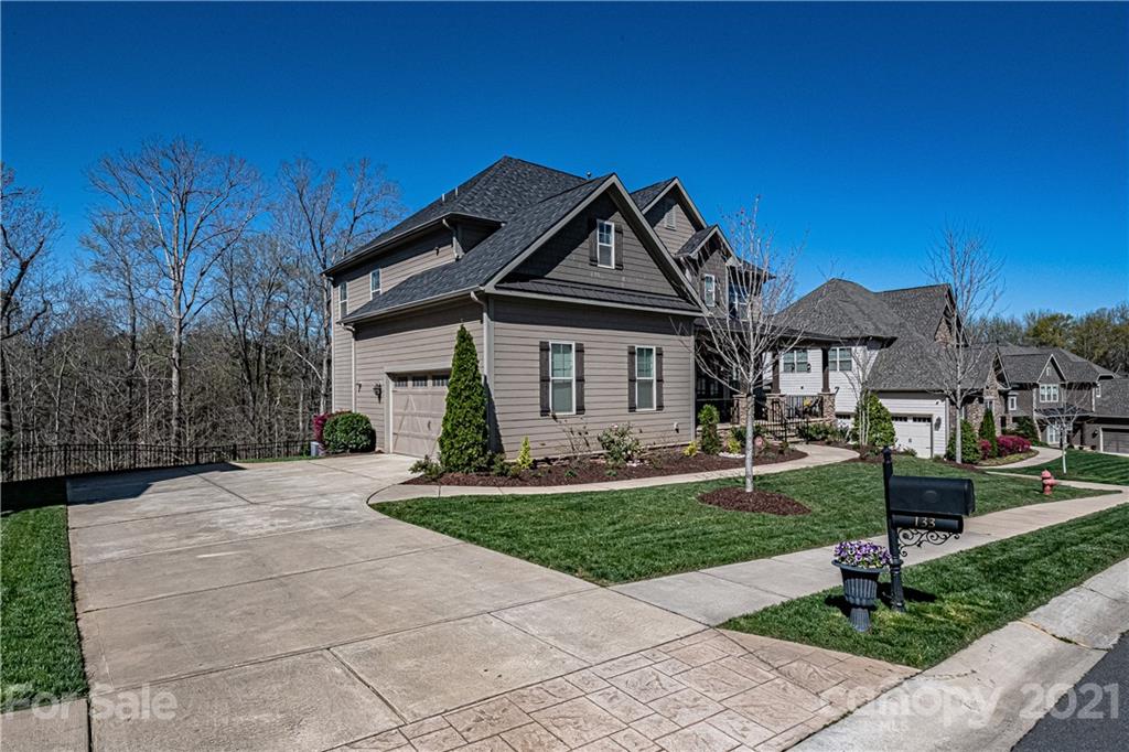 133 Forsythia Lane Tega Cay, SC 29708 - Photo 3 of 48 a front view of a house with a yard