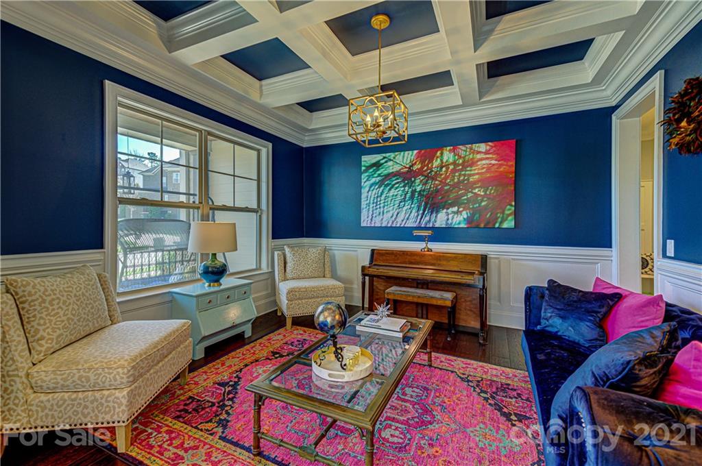133 Forsythia Lane Tega Cay, SC 29708 - Photo 4 of 48 a living room with furniture a flat screen tv and a window