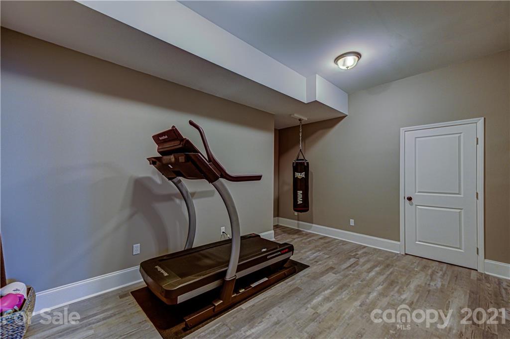 133 Forsythia Lane Tega Cay, SC 29708 - Photo 40 of 48 a room with gym equipment