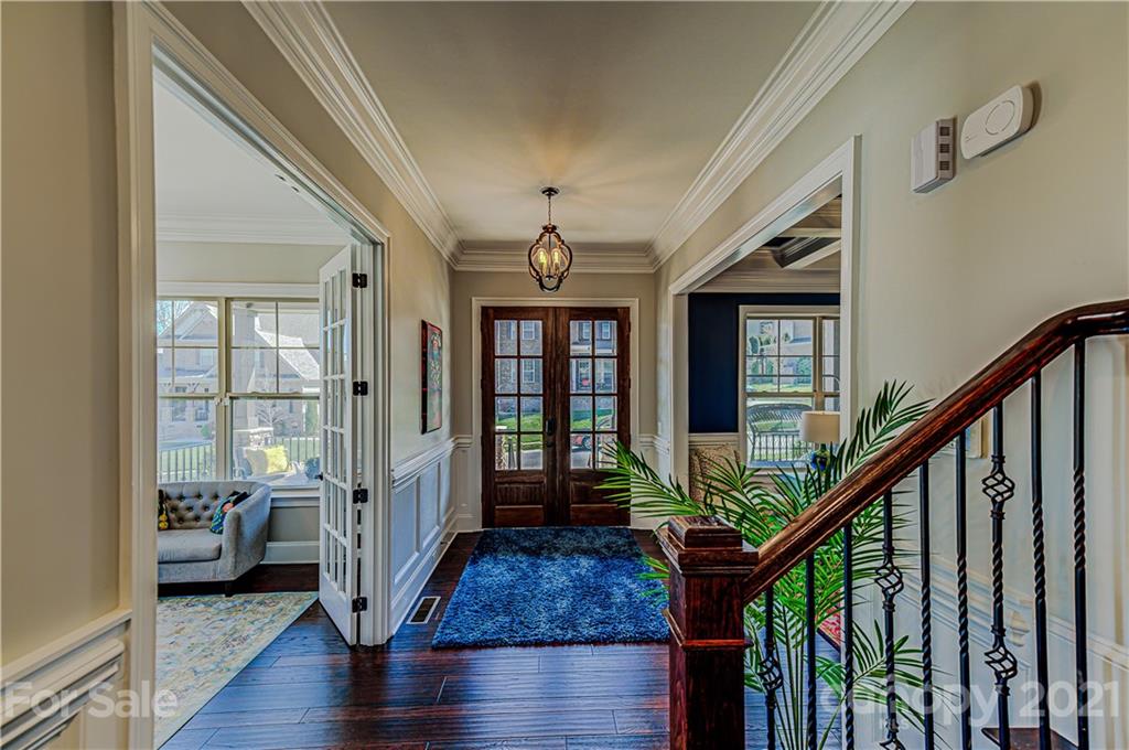 133 Forsythia Lane Tega Cay, SC 29708 - Photo 5 of 48 a view of an entryway with wooden floor and windows