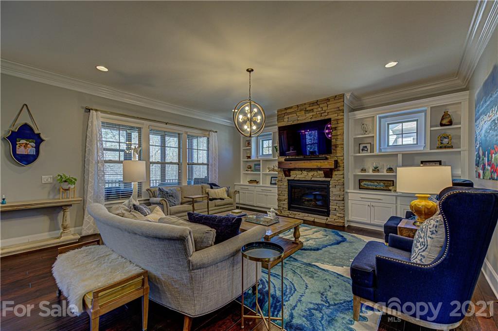 133 Forsythia Lane Tega Cay, SC 29708 - Photo 9 of 48 a living room with fireplace furniture and a chandelier