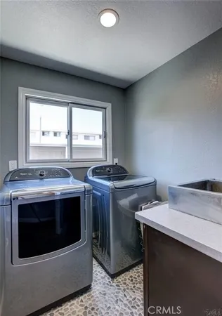 a view of a kitchen with a sink and a stove top oven