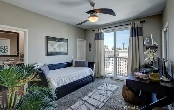 a bedroom with double bed and a window