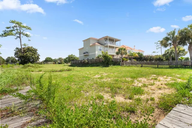 a view of a lake with a house in the background