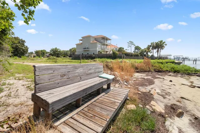 a view of a terrace with wooden floor and lake view