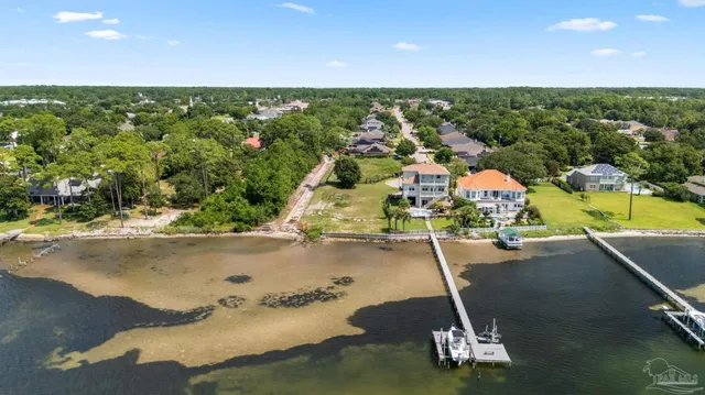 a view of a swimming pool with a yard