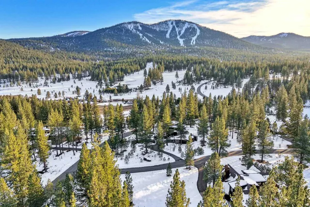 a view of a city with mountains in the background