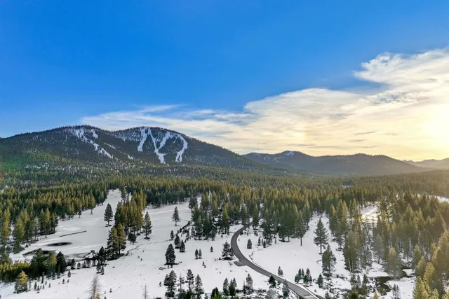 a view of a town with mountains in the background