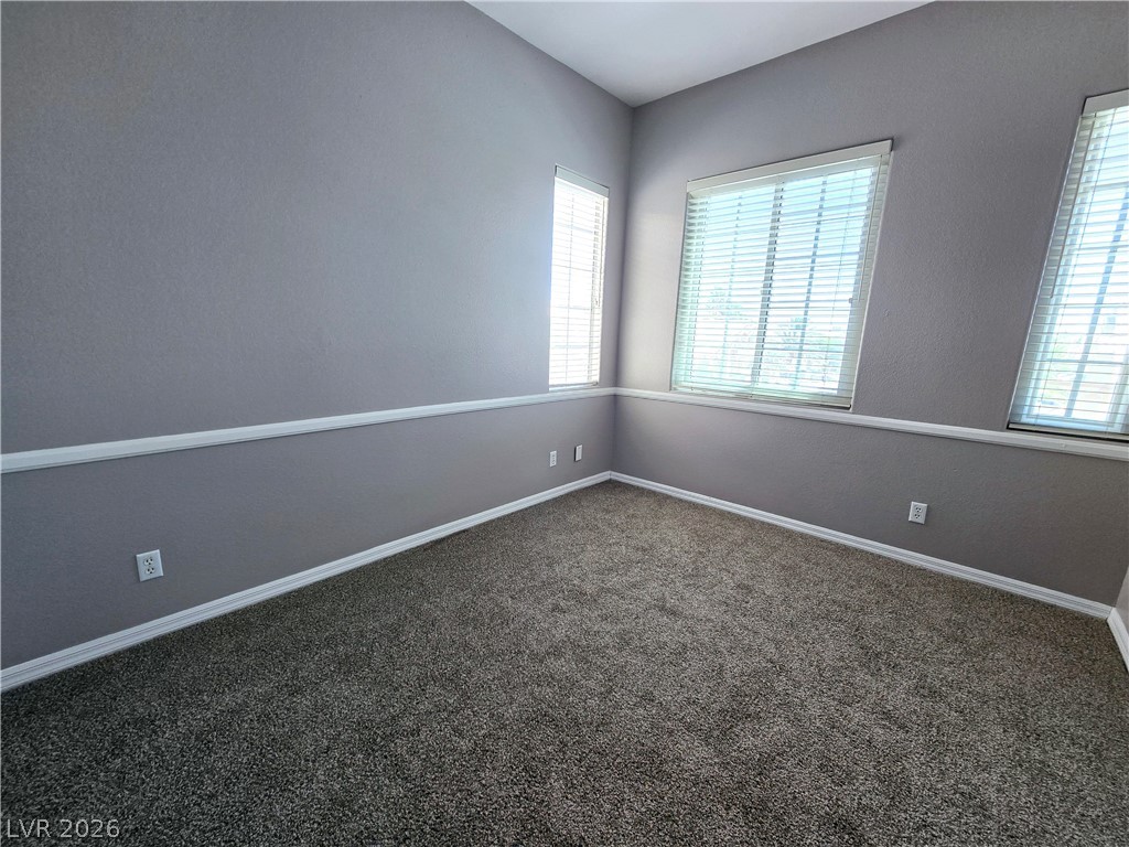 3759 Funston Way Las Vegas, NV 89129 - Photo 30 of 31 Well-lit room with plush carpeting and natural light filtering through the window blinds.