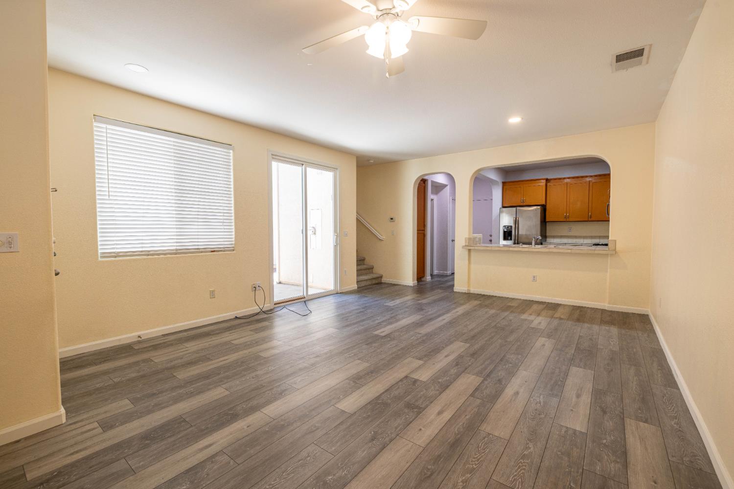 3122 Lea Sterling Way Rancho Cordova, CA 95670 - Photo 5 of 31 wooden floor in an empty room with a window