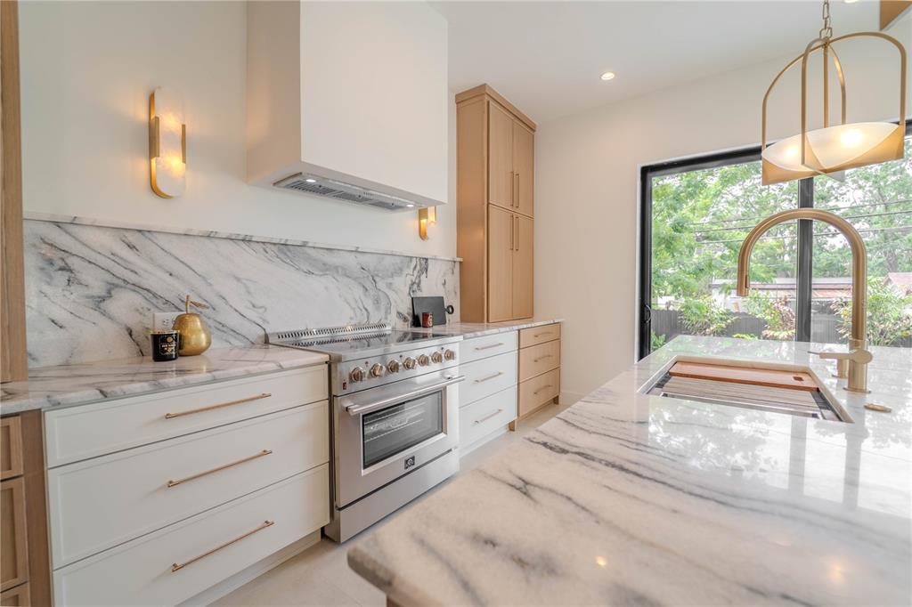 4502 South Shamrock Road Tampa, FL 33611 - Photo 13 of 41 a spacious bathroom with a granite countertop sink and a mirror