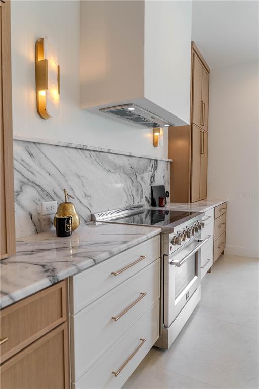 4502 South Shamrock Road Tampa, FL 33611 - Photo 14 of 41 a kitchen with white cabinets and appliances