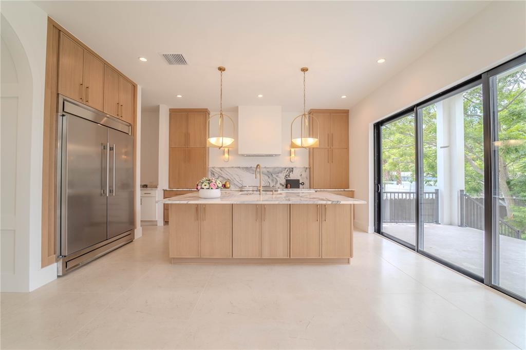 4502 South Shamrock Road Tampa, FL 33611 - Photo 21 of 41 a view of kitchen with stainless steel appliances granite countertop cabinets and a large window